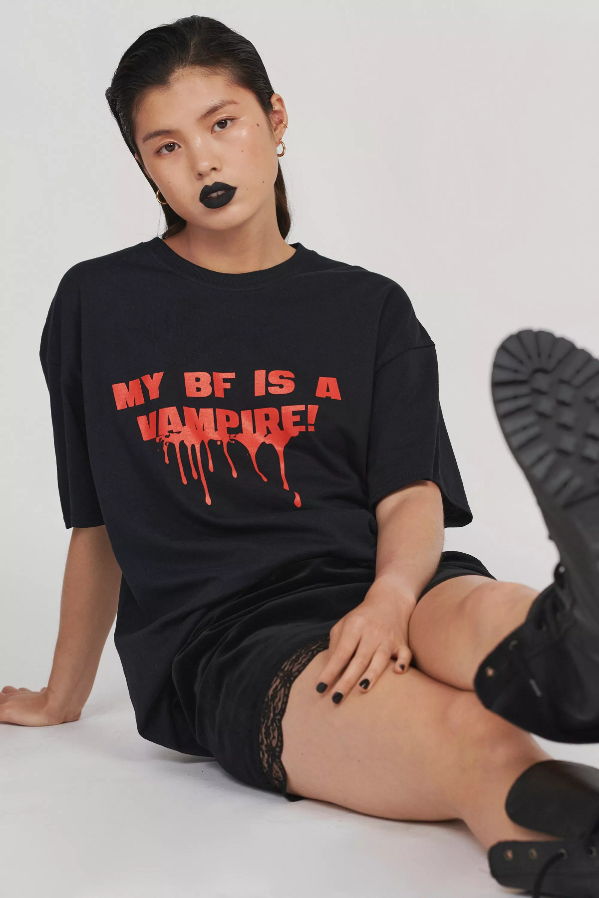 A person wearing a T-shirt that says my bf is a vampire