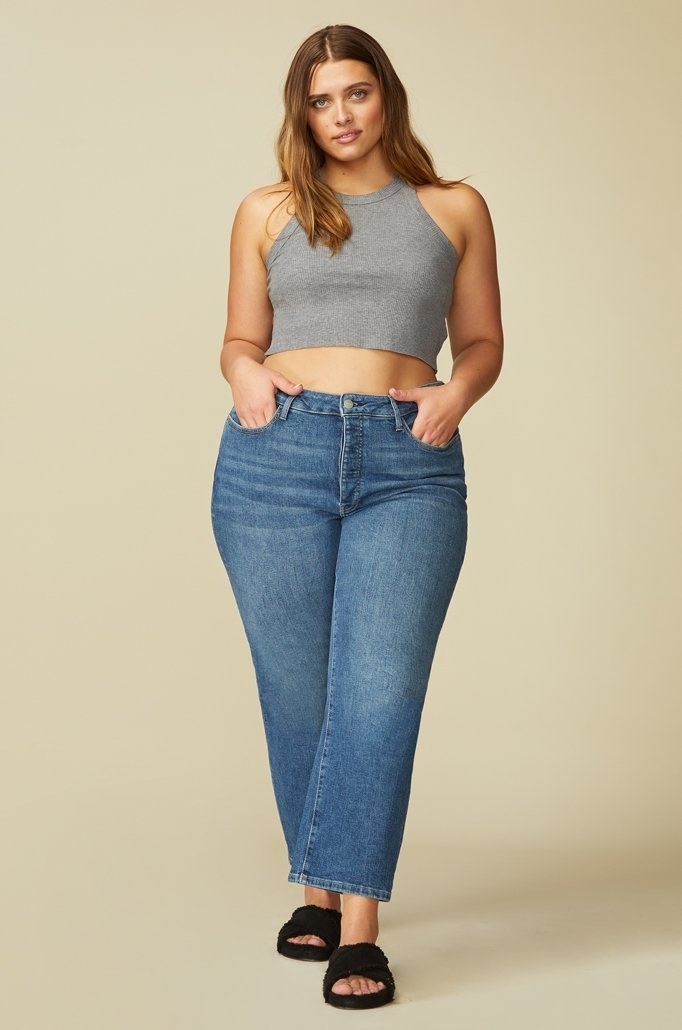 Model in straight leg mid wash jeans