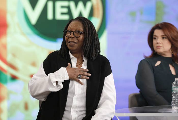Whoopi Goldberg talking as Ana Navarro sits next to her