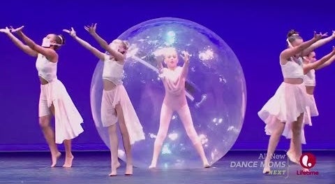 JoJo Siwa dancing in a bubble