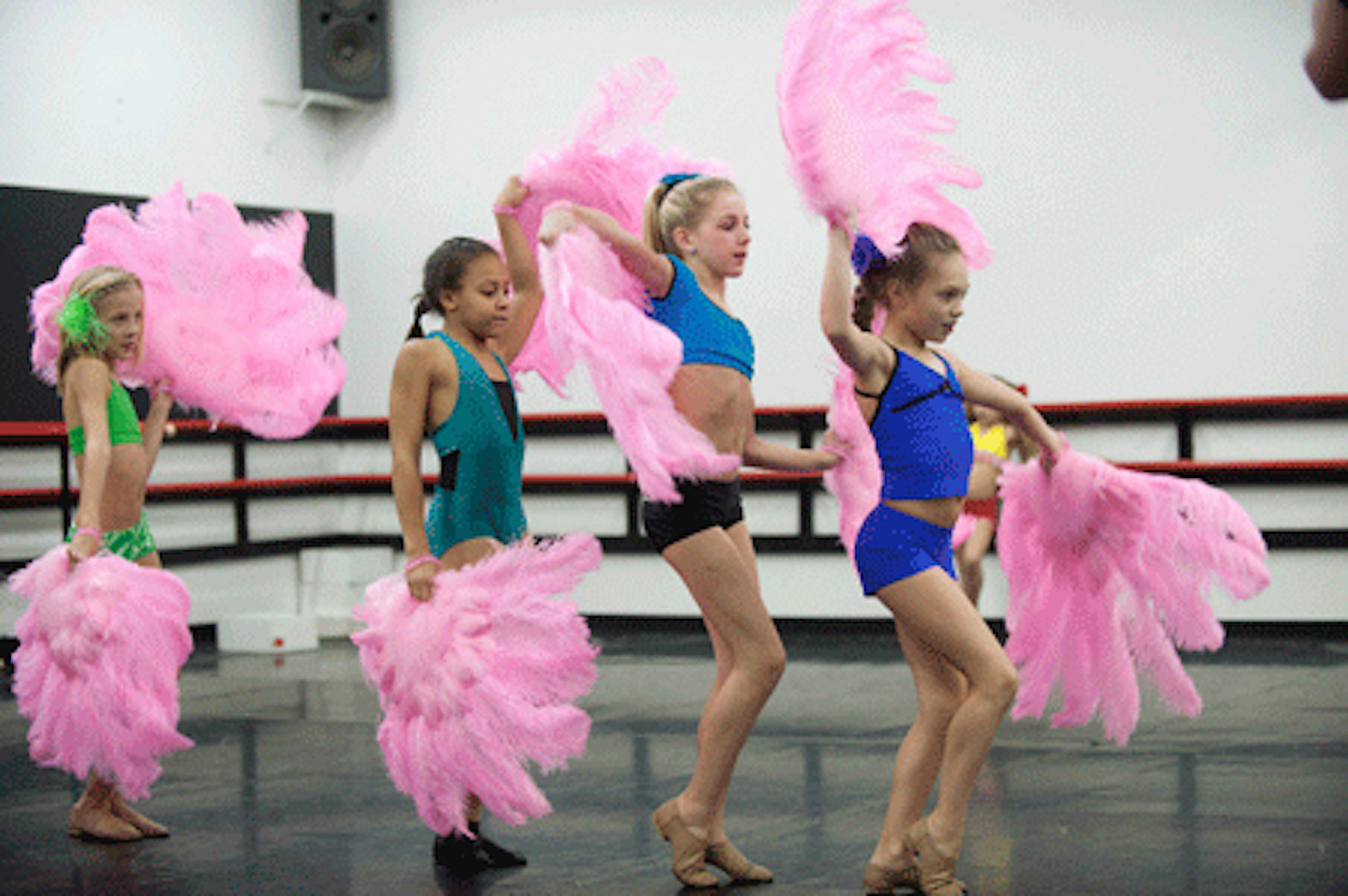 The dance team practicing their feather dance