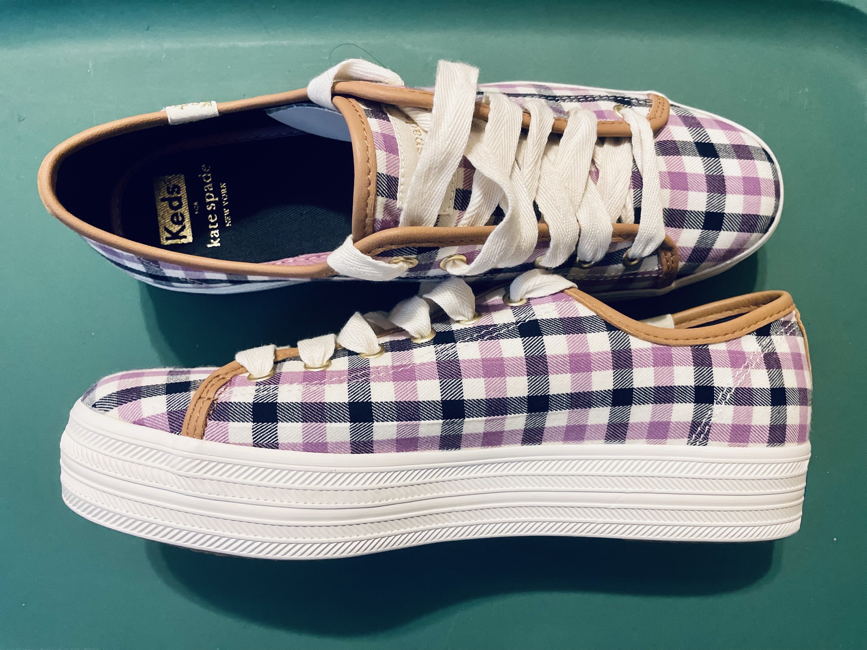 the purple and blue plaid sneakers with brown leather trim and white platform sole