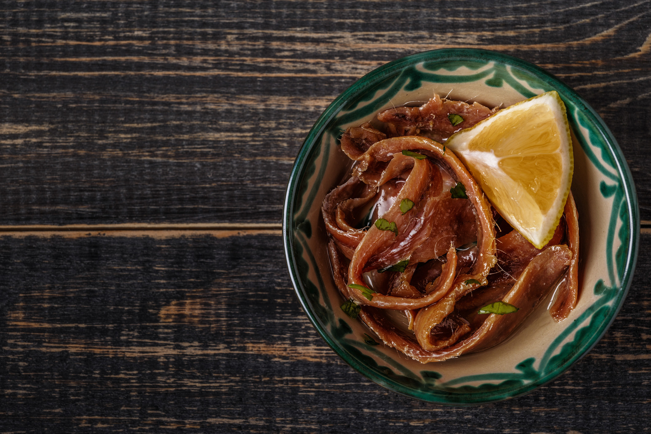 A bowl of anchovies.