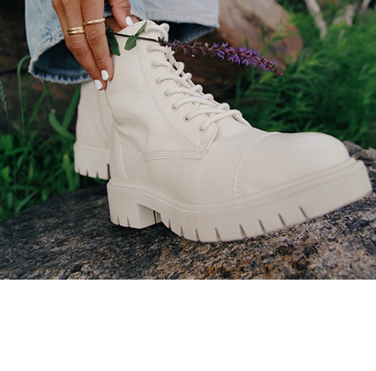 A person wearing chunky combat boots