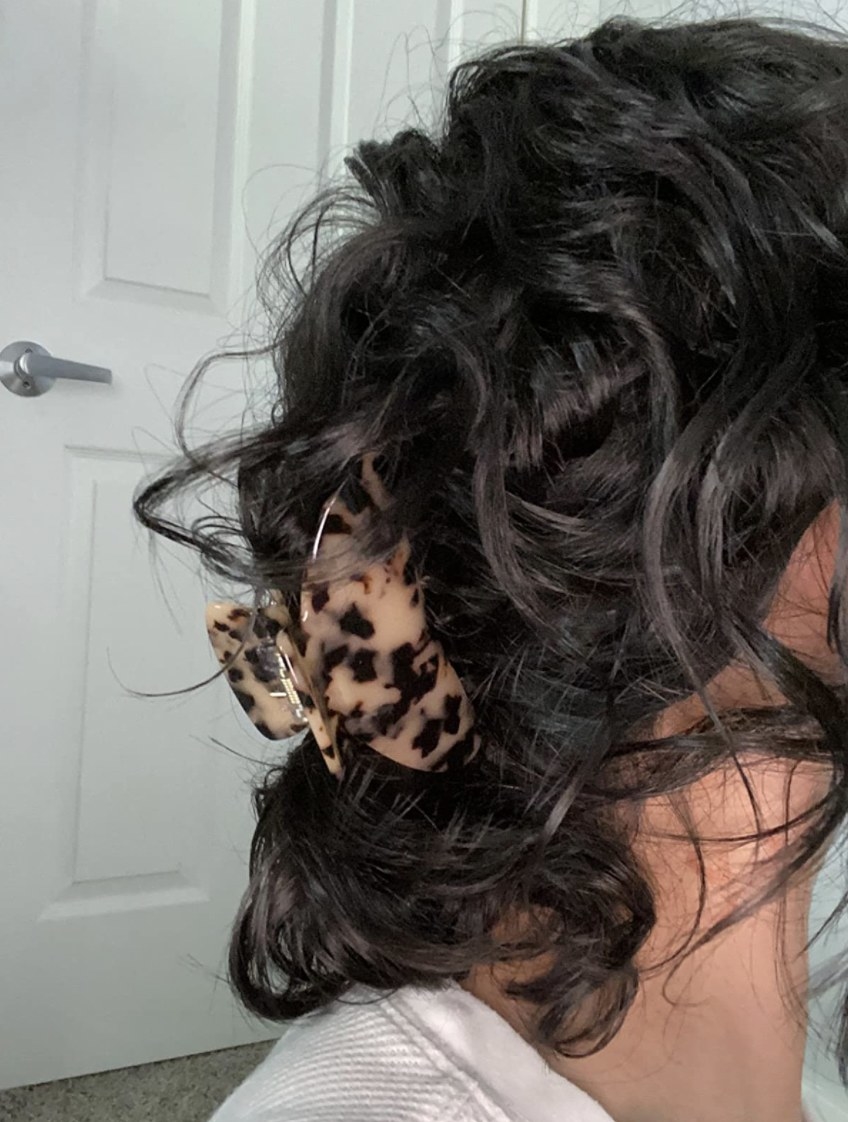 Lady wearing cheetah print clip in hair