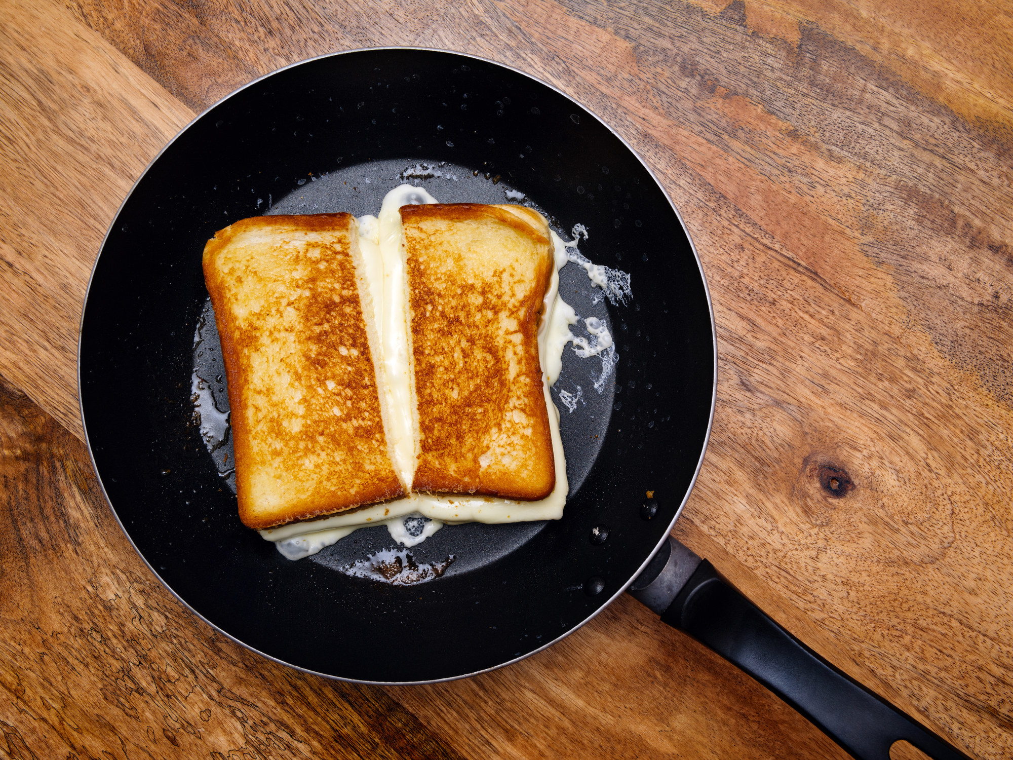 Grilled cheese in a skillet.