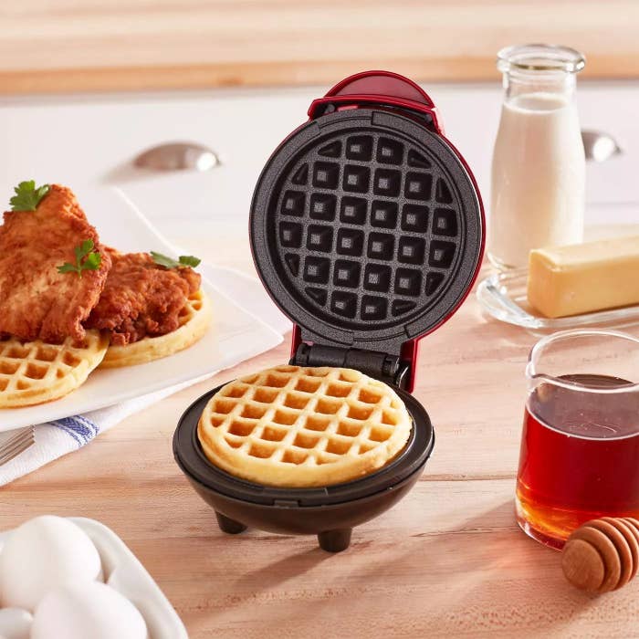 The waffle maker making a waffle in a kitchen
