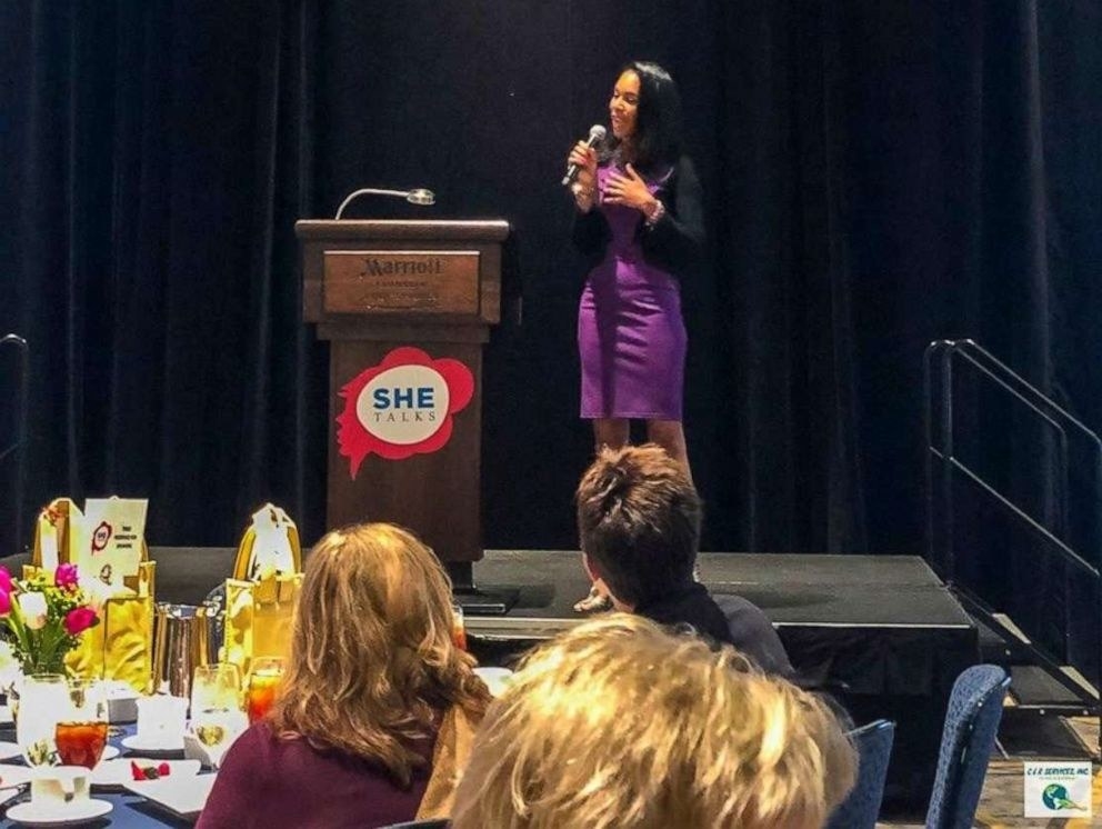 Lakisha Simmons delivering a keynote at a women&#x27;s conference.