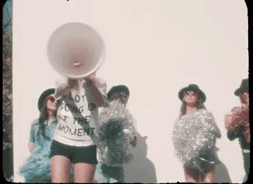 Taylor Swift with a megaphone in the 22 music video