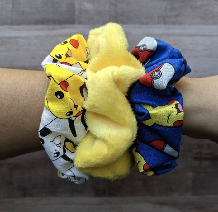 an arm with pikachu printed scrunchies on it
