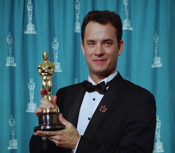 Tom Hanks holding his Best Actor Oscar for Philadelphia