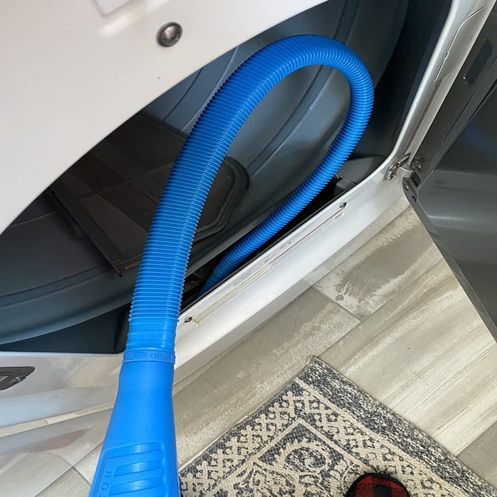 The vacuum hose attachment inside of a dryer's lint trap