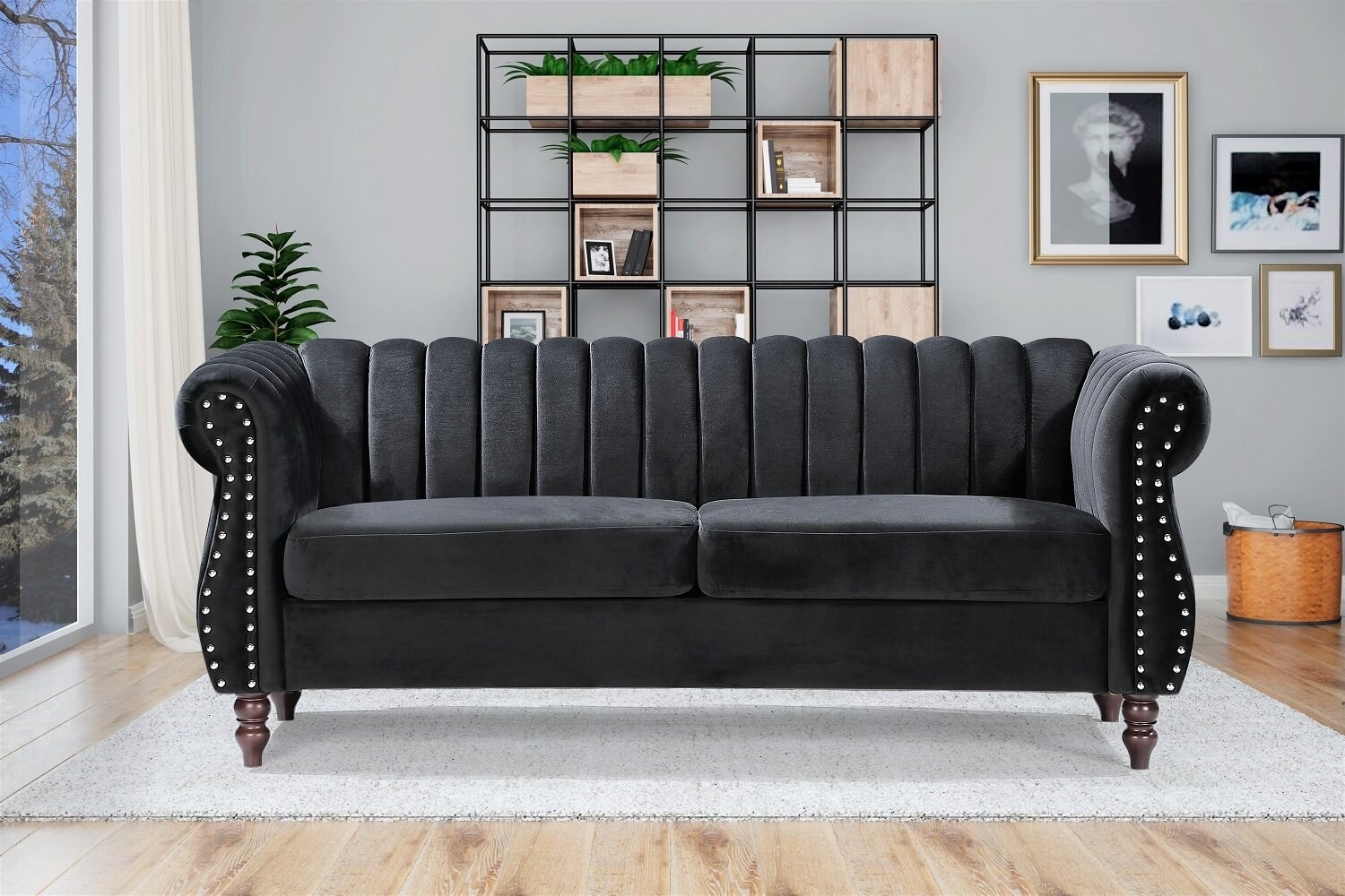 A green velvet, rolled arm chesterfield sofa with nailhead accents