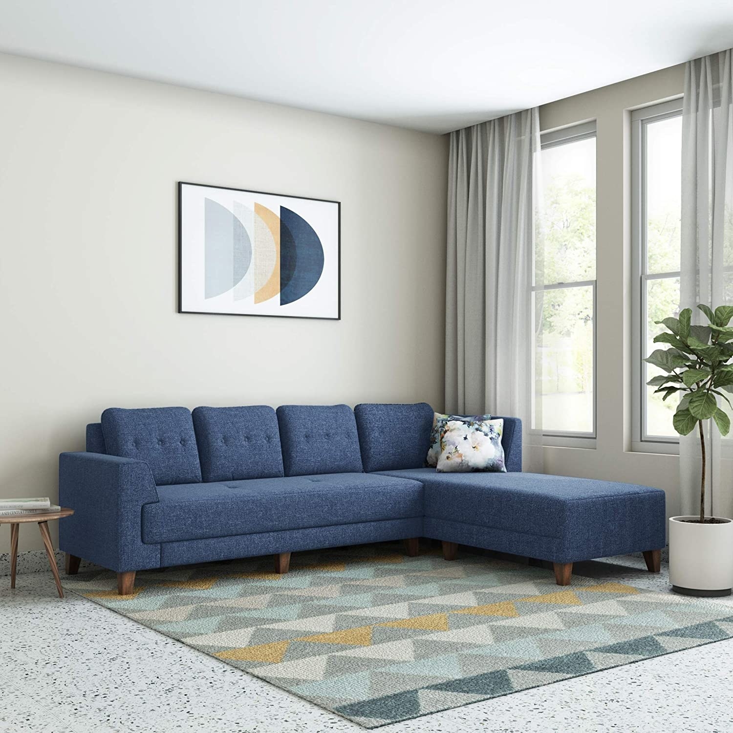 A blue sofa with a pillow
