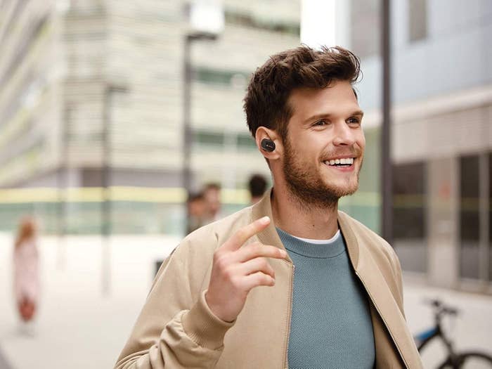 A man listening to music with the wireless earphones