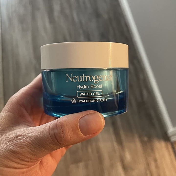 A reviewer holding the Hydro Boost Water Gel