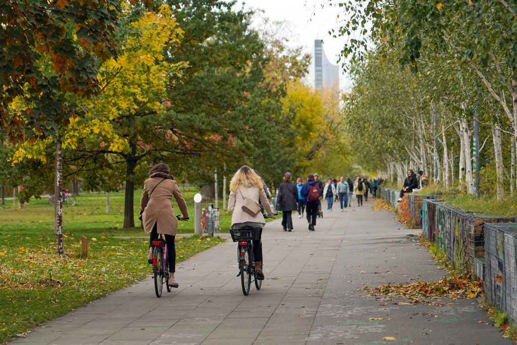 People walking and bike riding in a public park