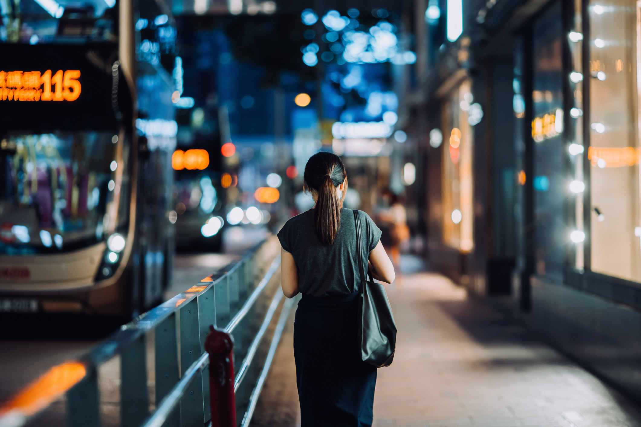 A woman walking home alone at night