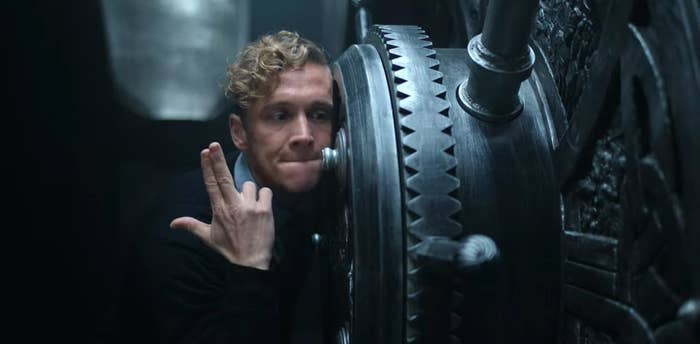 Dieter making a finger gun as he cracks a safe in "Army of Thieves"