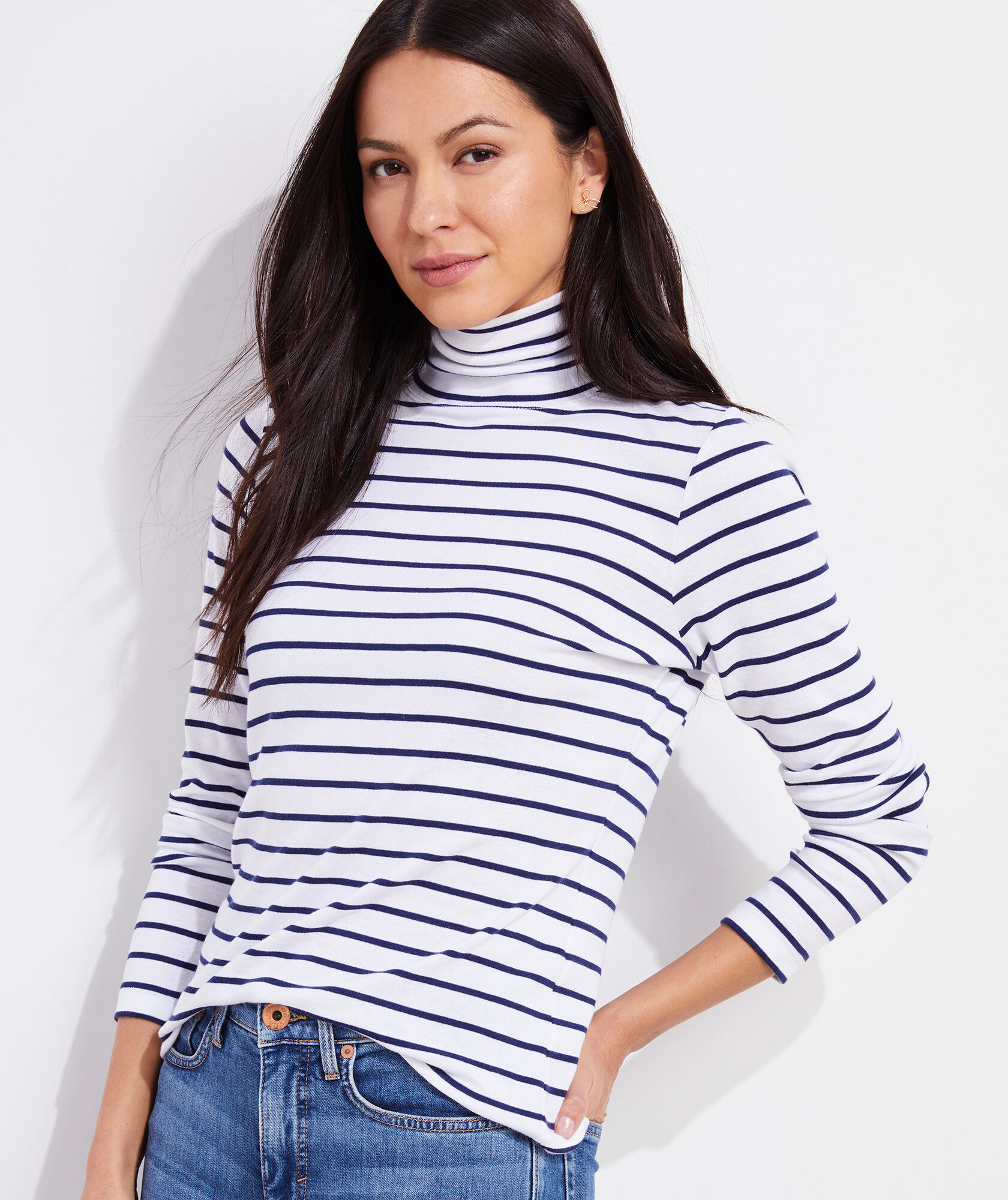 model in a turtleneck shirt with horizontal stripes on it