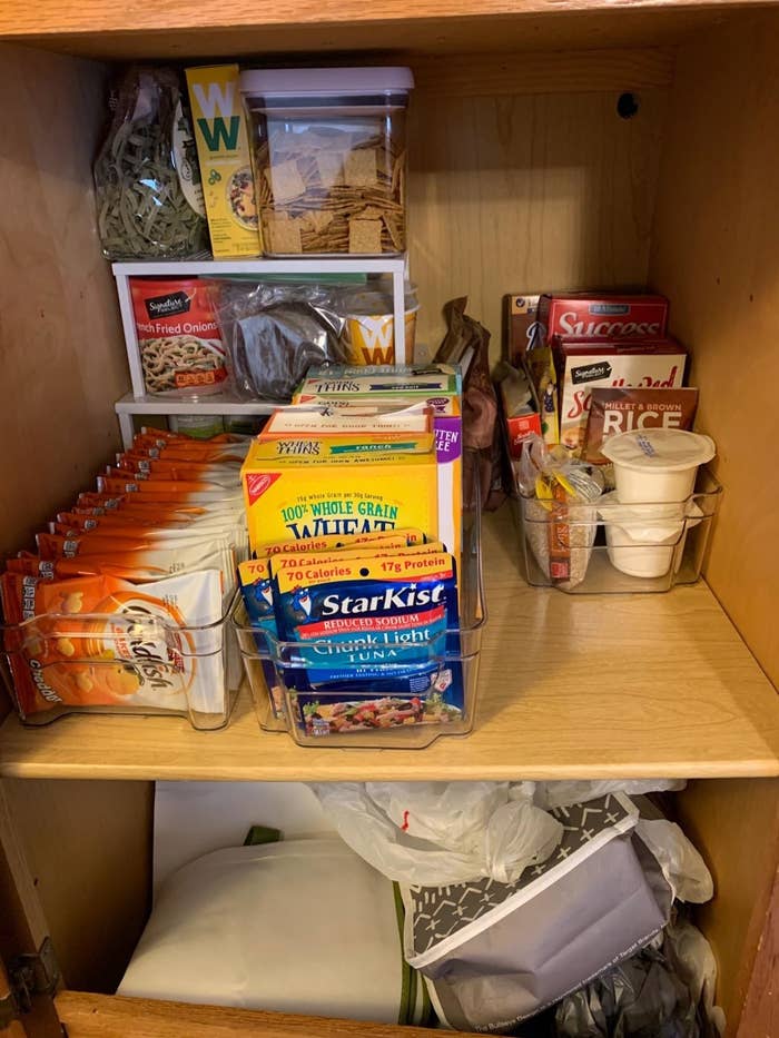 A customer&#x27;s pantry filled with several pantry organizers
