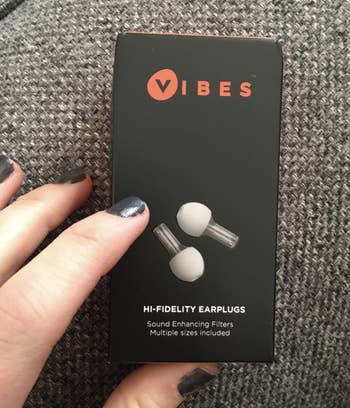 A customer review photo of them holding the box of the earplugs