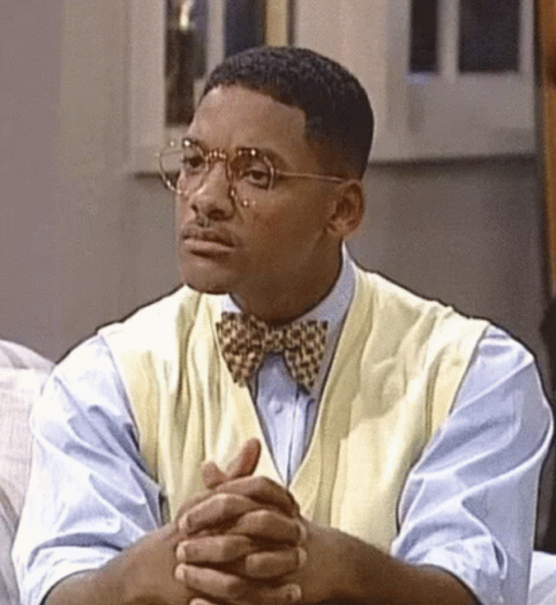 Will Smith on &quot;The Fresh Prince of Bel-Air&quot; wearing a bowtie, glasses, and folding his hands on his lap in a confused manner