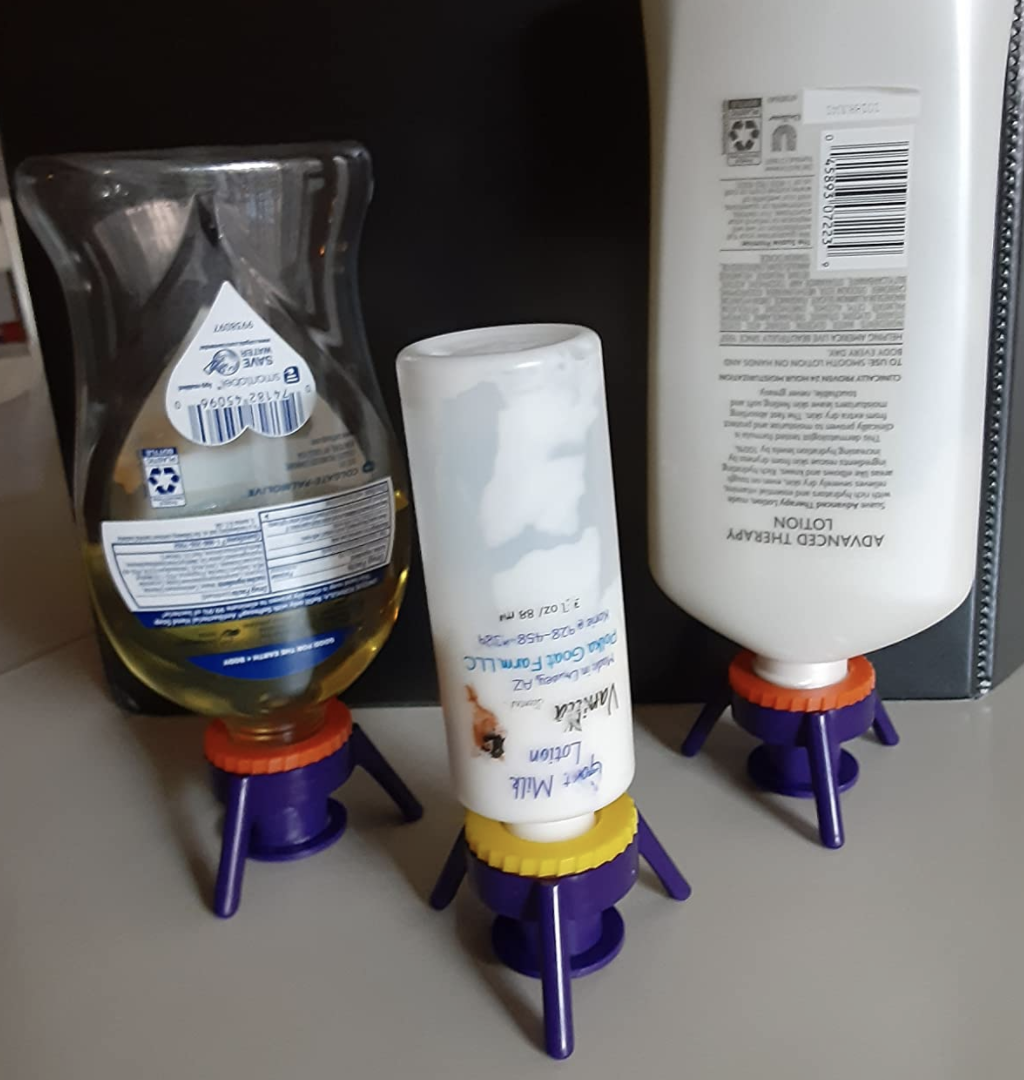 A customer review photo of three bottles upside down using the Flip-It!