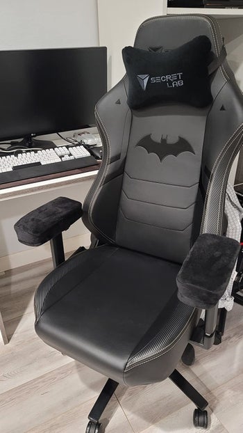 the armrest pads on an office chair in black