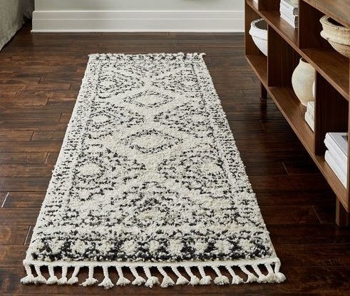 Moroccan style thick pile runner rug with tassel accents on the ends