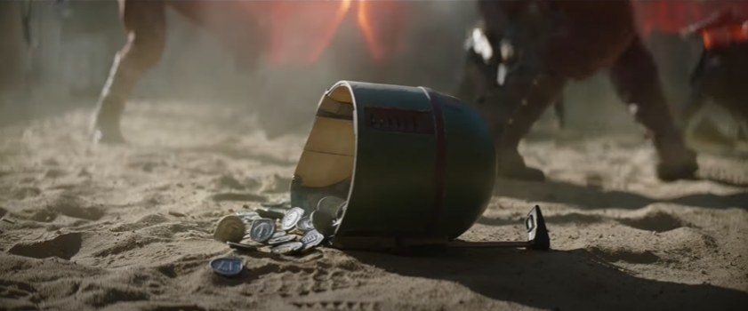 Coins pour out of Boba Fett&#x27;s empty helmet