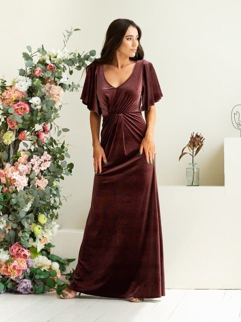 model in flutter sleeve v-neck purplish brown gown