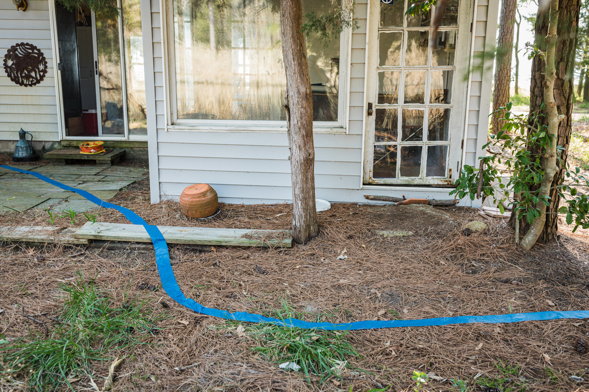 A home and glass front door with a blue line around it