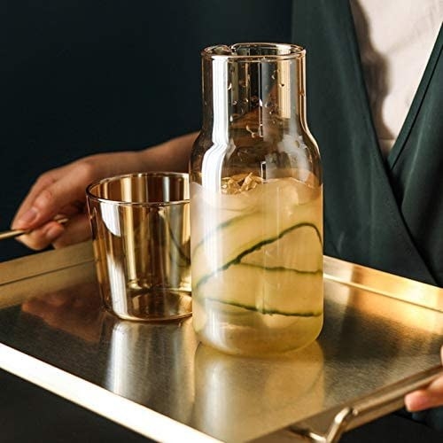 the carafe and matching glass on a serving tray