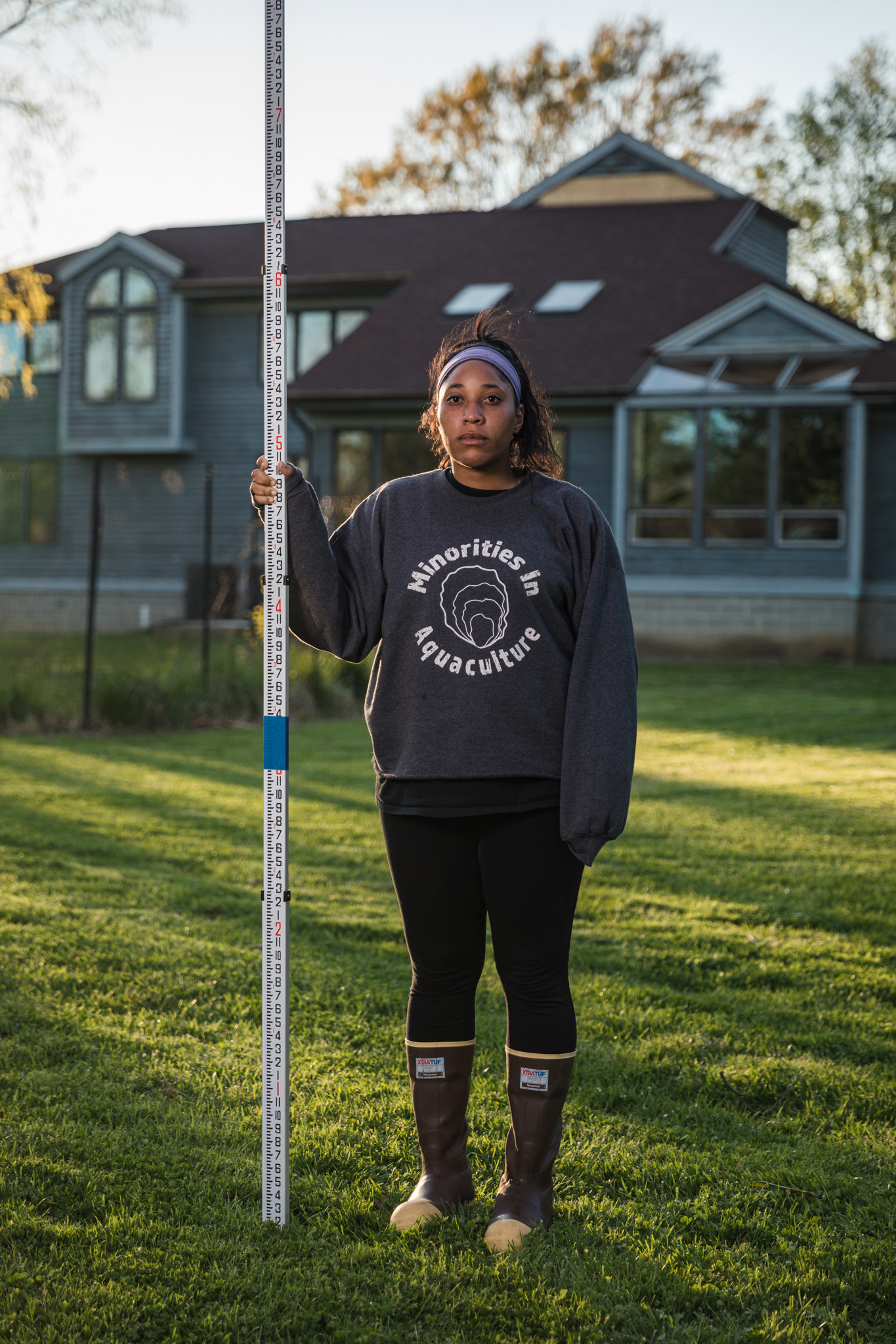 A woman wearing a T-shirt that says &quot;minorities in aquaculture&quot;