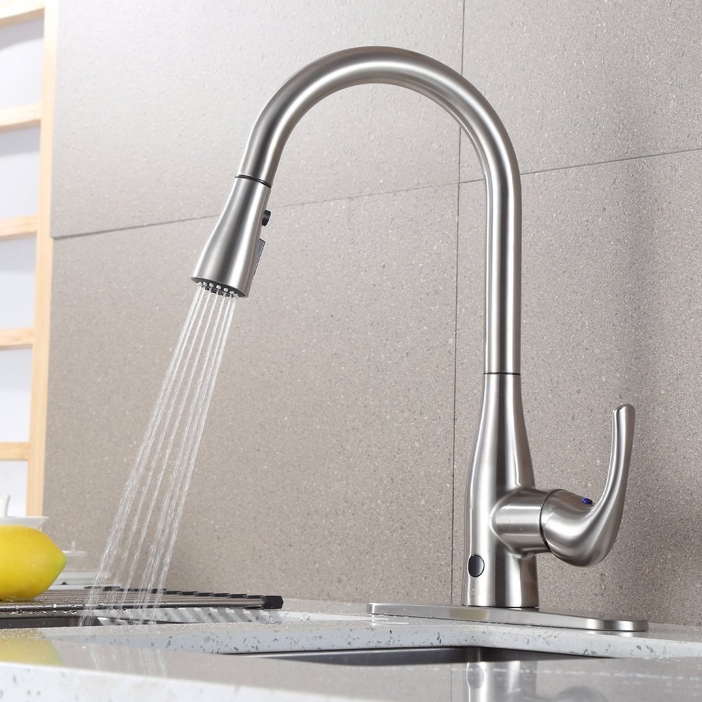 curved kitchen faucet in silver with handle and detachable top