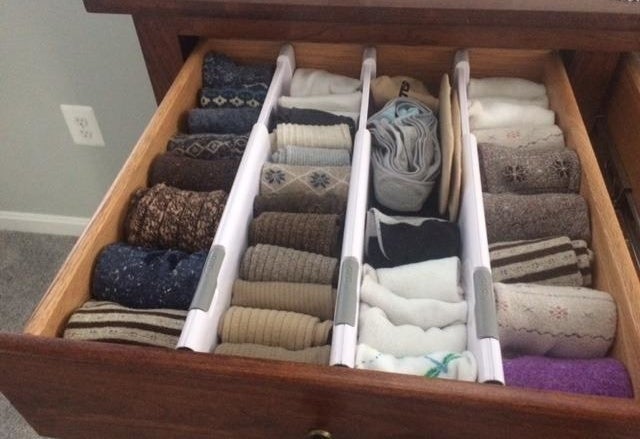 a reviewer photo of the open drawer with three expandable dividers inside