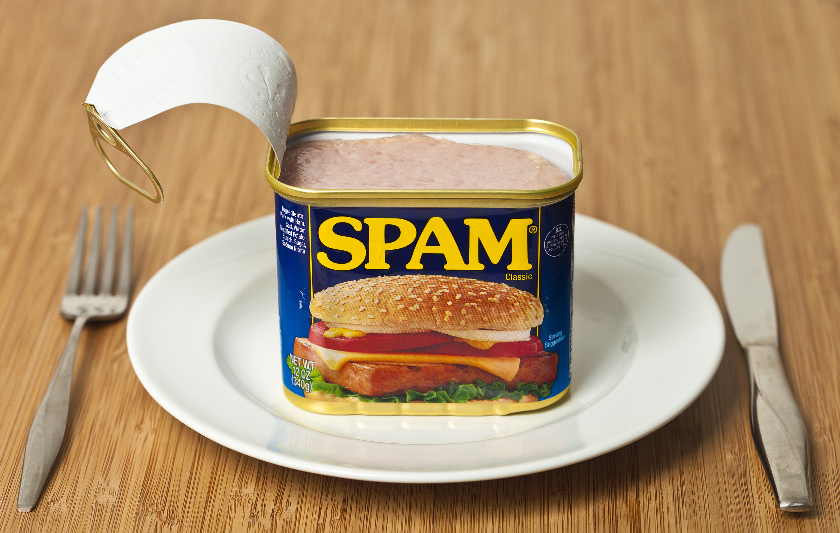 A can of Spam on a plate.