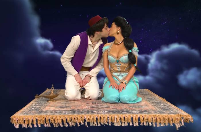 Kim and Pete kissing in an Aladdin and Jasmine costume