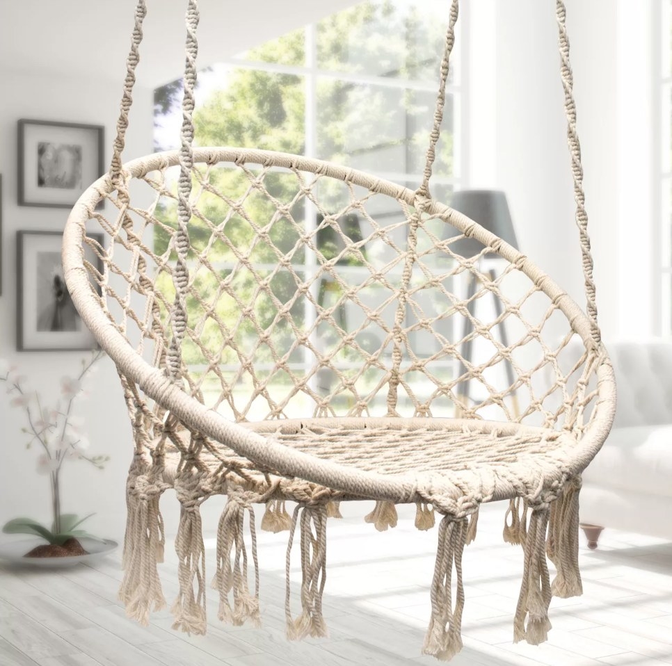 A hanging macrame rope chair