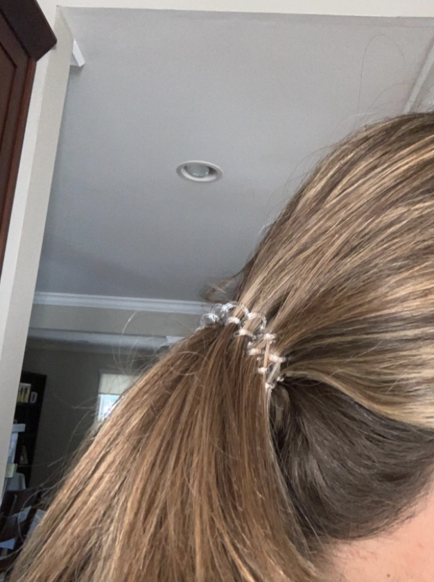 reviewer pic of  the hair tie holding a ponytail up