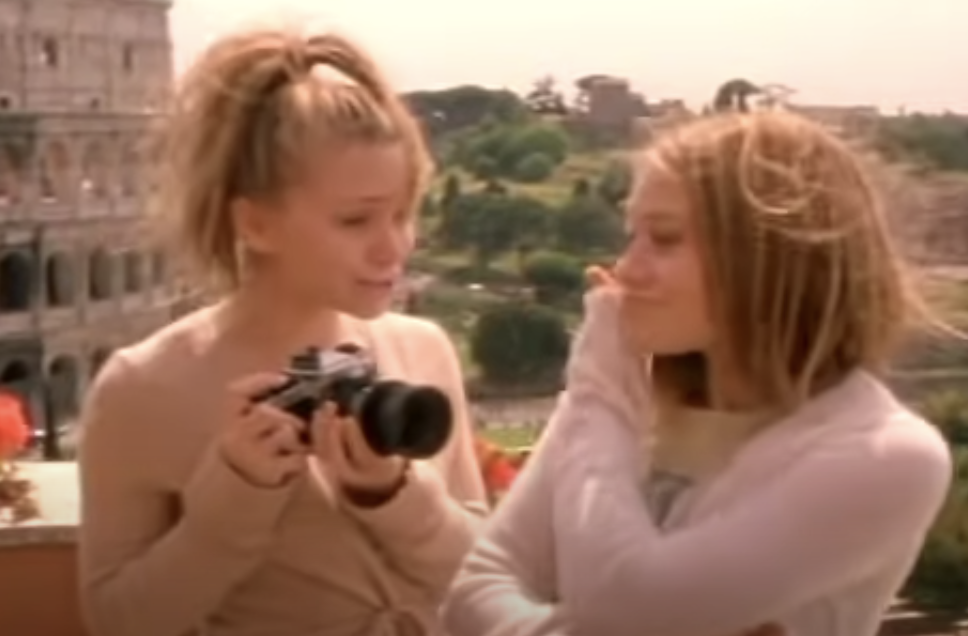 Mary-Kate and Ashley stand in front of the colosseum as Charli and Leila