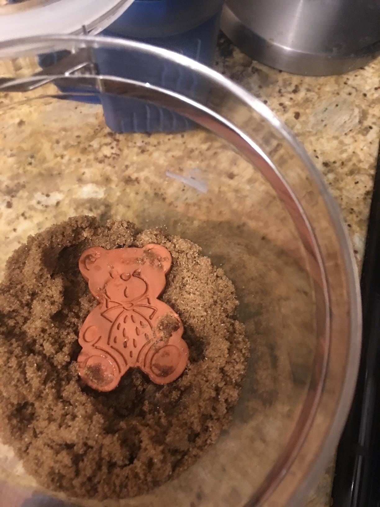 the brown sugar bear in a container of brown sugar