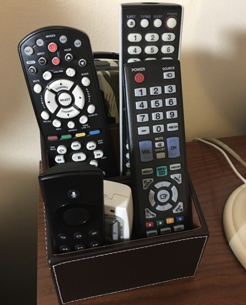 A customer review photo of the organizer with several TV remotes in it