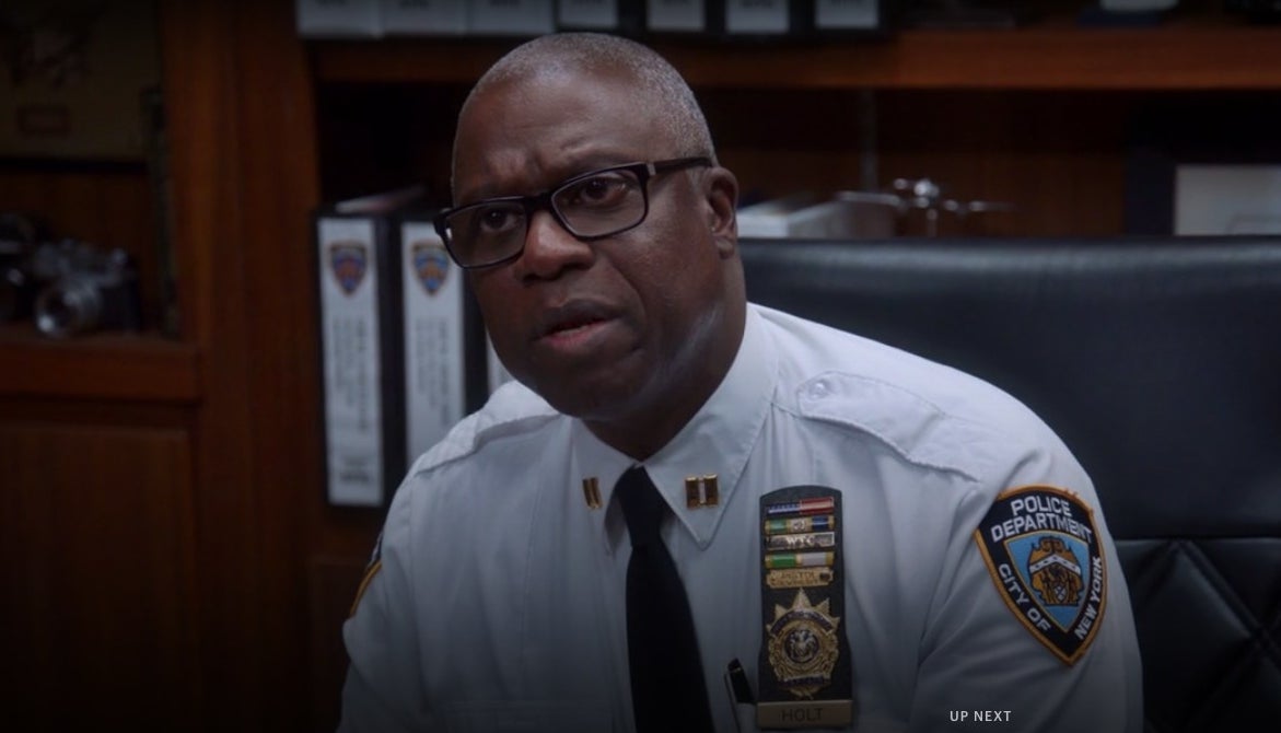 Holt sitting at his desk with glasses in &quot;Brooklyn Nine-Nine&quot;