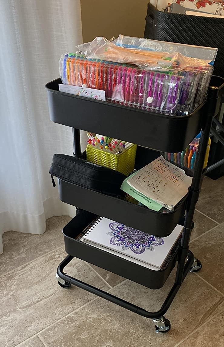 Reviewer photo of the black cart filled with art supplies