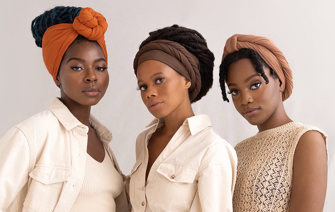 Three models wearing hair wraps