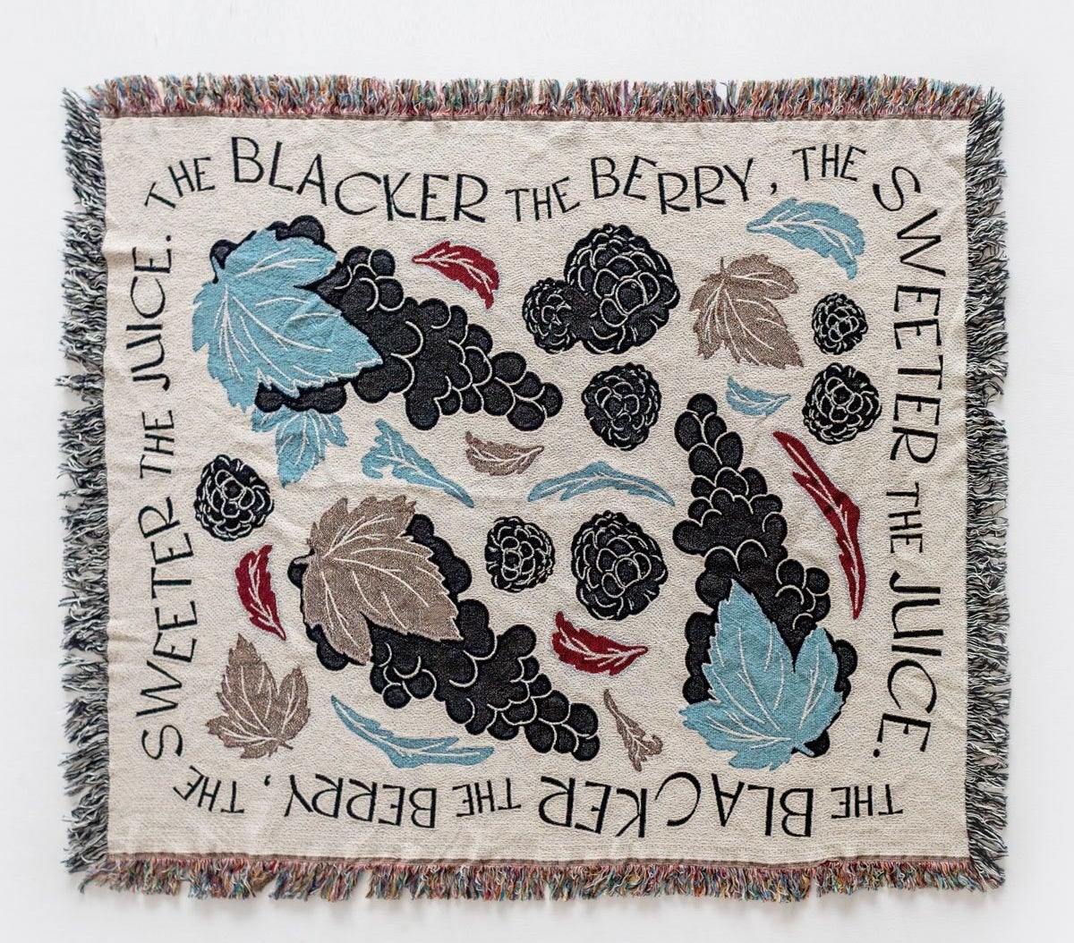 a blanket with blackberries and leaves on it with a boarder that says &quot;the blacker the berry the sweeter the juice&quot;