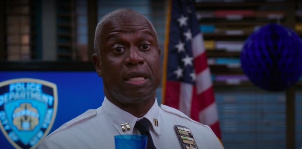 Holt holding a drink and talking to his precinct in &quot;Brooklyn Nine-Nine&quot;