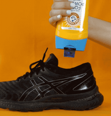 gif of model spraying the powder into a shoe